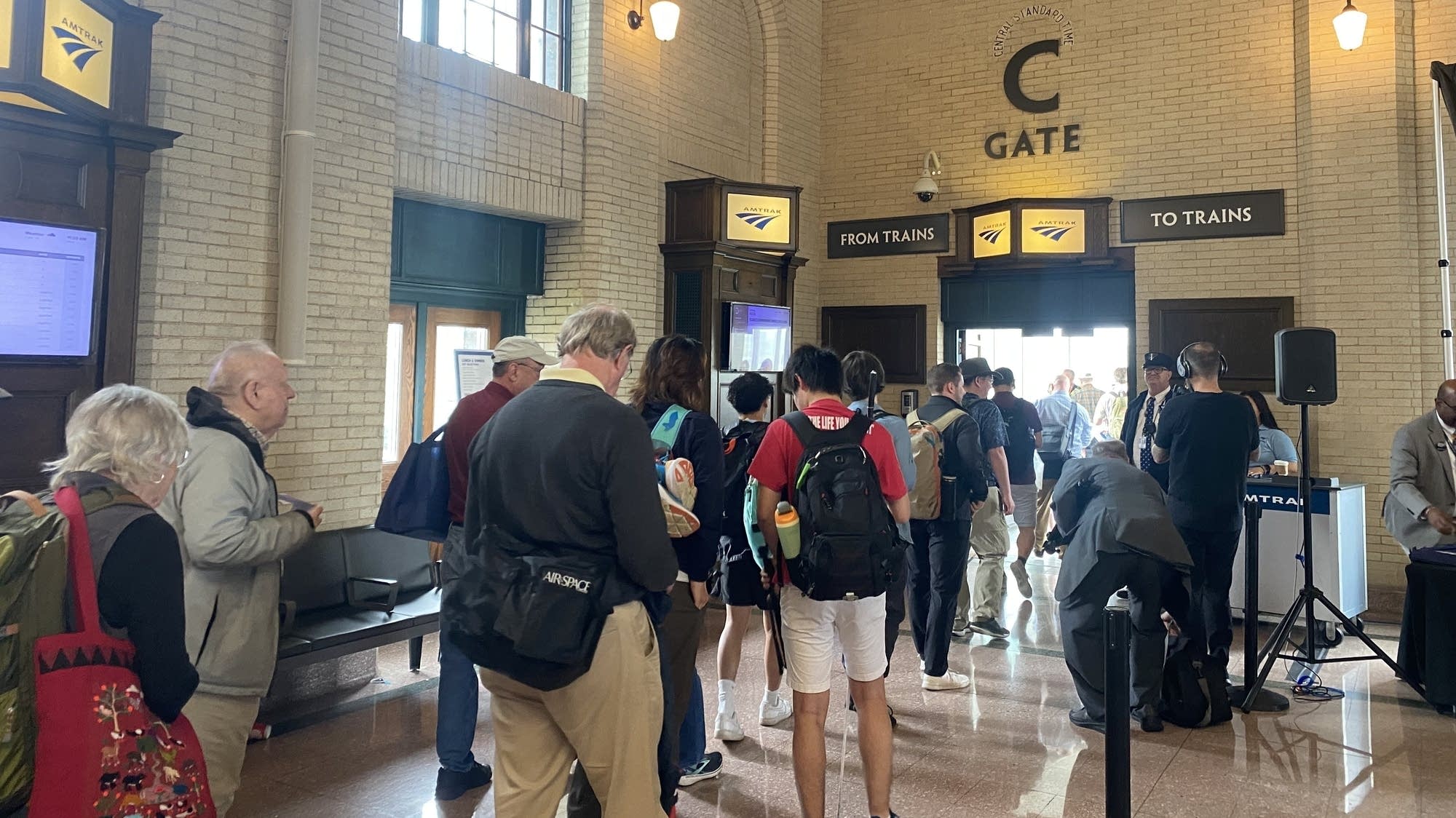 Amtrak reaches new milestone with Twin Cities to Chicago Borealis route 7bcdb1 20240521 people walk to gate c at a train station 2000