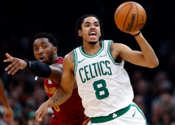 Josh Minott's Celtics got the better of Donovan Mitchell (left) and the Cavaliers on Wednesday night at TD Garden.