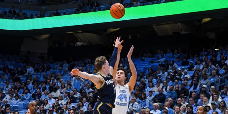 Maximo Adams recruiting photo shoe wall