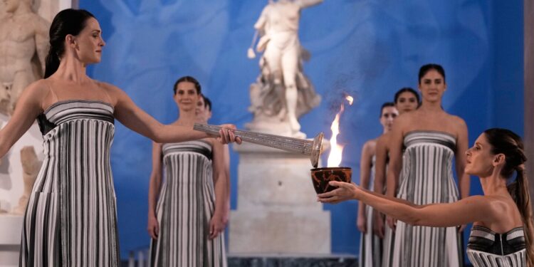 Olympic flame begins journey to Milan Cortina Winter Games amid bad weather
