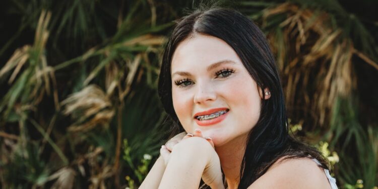 Step-sibling of cheerleader found dead on Carnival cruise may face charges: Filing