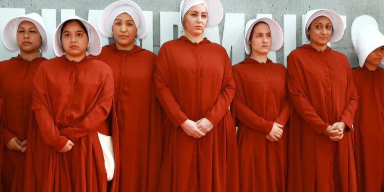 What inspired the outfits in Margaret Atwood's "The Handmaid's Tale"
